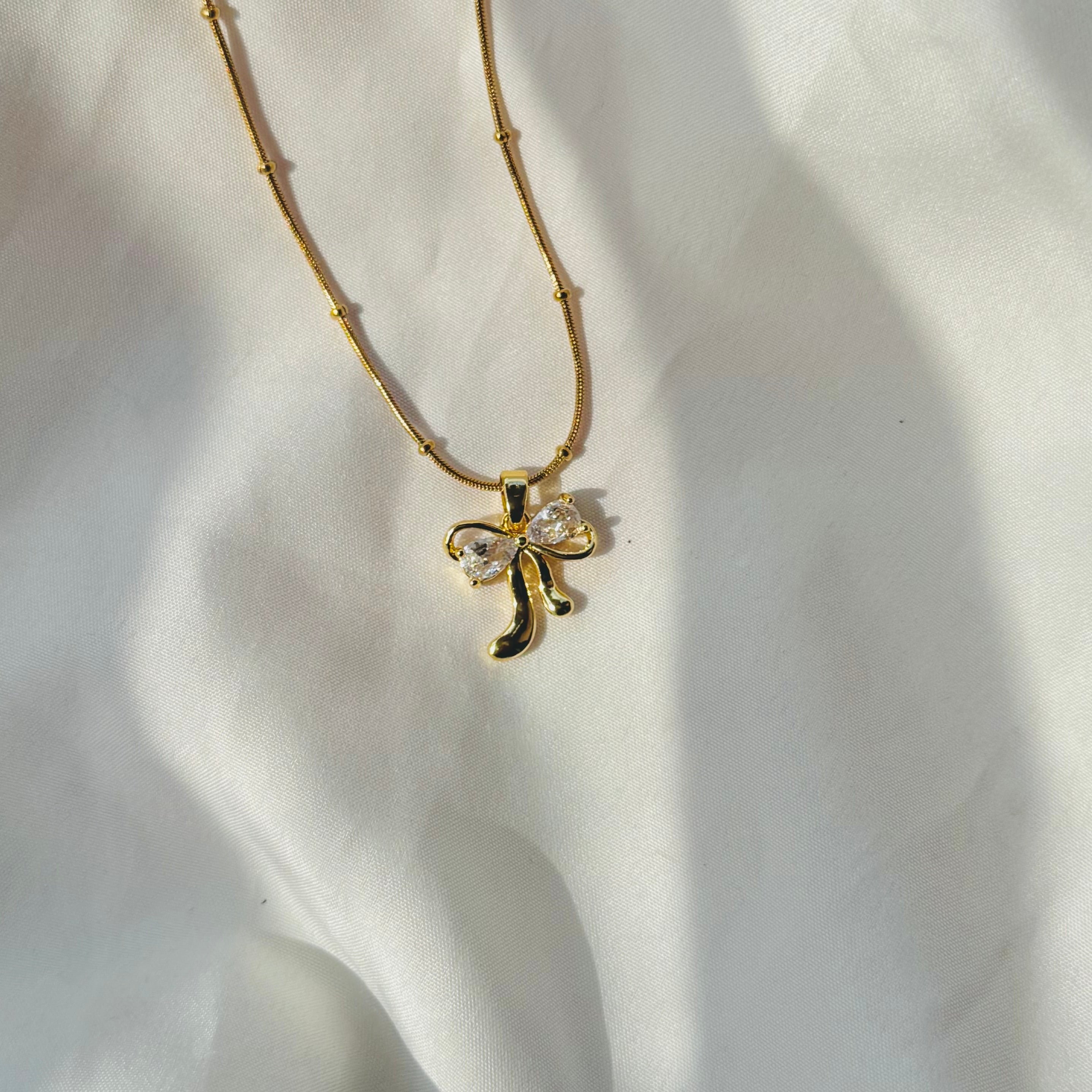 Diamond bow necklace